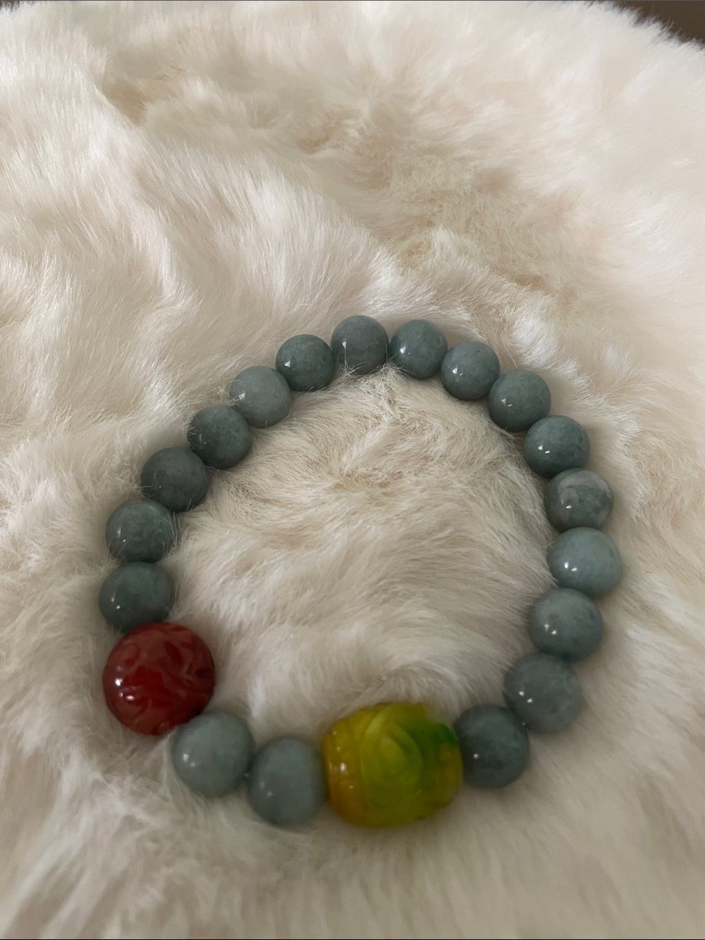 Green Beaded Stretch Bracelet with Red and Yellow Accent Beads